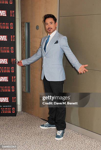 Robert Downey Jr poses at the Iron Man 3 photocall at The Dorchester on April 17, 2013 in London, England.