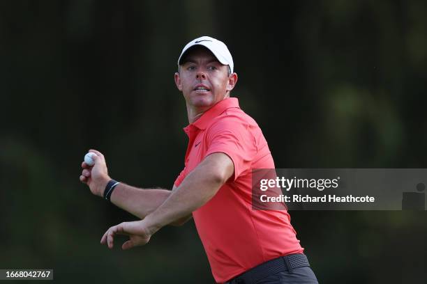 Rory McIlroy of Northern Ireland throws his ball to the crowd in celebration after holing out for an eagle on the 16th hole during Day Two of the...