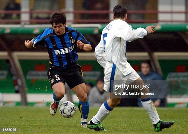 Belozoglu Emre of Inter Milan in action during the Serie A match between Inter Milan and Brescia, played at the 'Giuseppe Meazza' San Siro Stadium,...