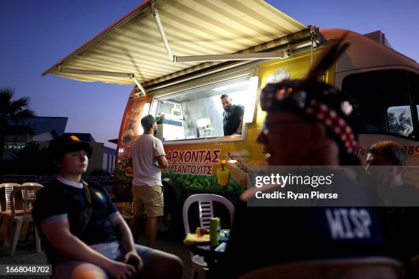 Fans of Scotland are seen next to a food and drink vendor outside the stadium prior to the UEFA EURO 2024 European qualifier match between Cyprus and...