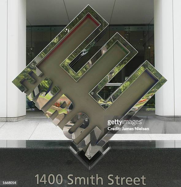 Enron's corporate logo is seen outside its headquarters May 28, 2002 in Houston, Texas. The unfinished River Oaks mansion once owned by former Enron...