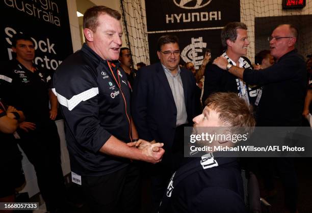 Michael Voss, Senior Coach of the Blues and Dylan Alcott celebrate during the 2023 AFL First Semi Final match between the Melbourne Demons and the...