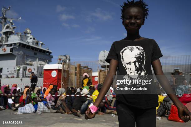 Migrant girl wears a t-shirt with the representation of Mustafa Kemal Ataturk, in Lampedusa Island of Italy on September 14, 2023. Located on the...