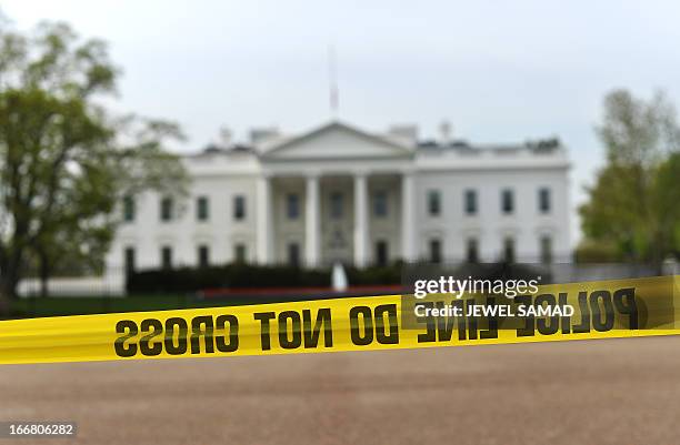 Police cordon off the area in front of the White House in Washington, DC, on April 17, 2013 following attacks at the Boston marathon. US President...