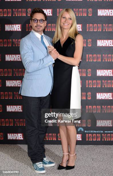 Robert Downey Jnr and Gwyneth Paltrow attend the Iron Man 3 photocall at The Dorchester on April 17, 2013 in London, England.