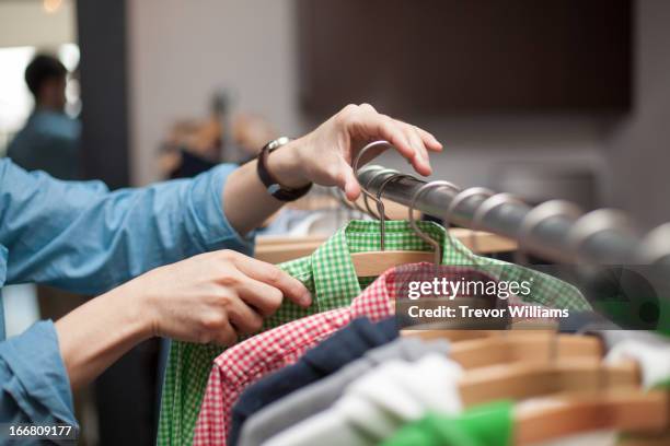 Person Pushing Garment Rack 1,535 Hand On Clothing Rack Stock Photos, High-Res Pictures, and Images ...