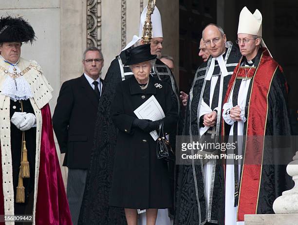 Queen Elizabeth II stands with The Most Reverend Justin Welby, Archbishop of Canterbury after the ceremonial funeral of former British Prime Minister...