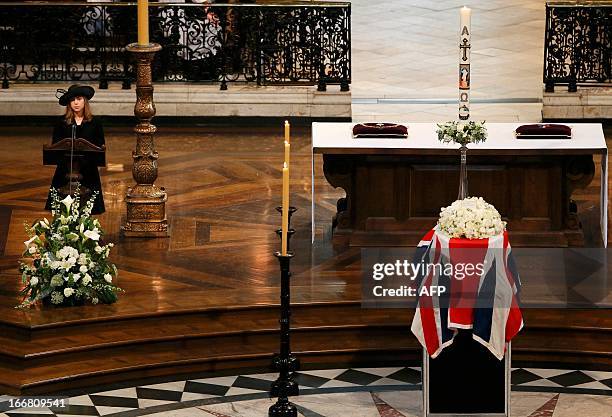 Amanda Thatcher, granddaughter of British former prime minister Margaret Thatcher gives a reading as her coffin sits draped in a Union Flag on the...