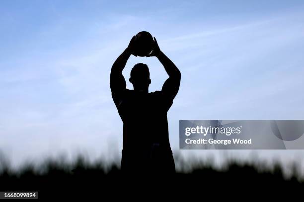 Silhouette of a player practicing a line out during the Premiership Rugby Cup match between Doncaster Knights and Cambridge at Castle Park on...