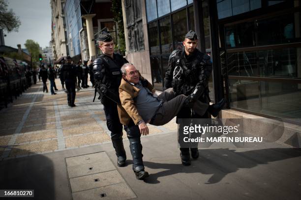 Protestor is arrested during a demonstration to call for the release of two Palestinian soccer players in an Israeli jail, on April 17, 2013 in front...