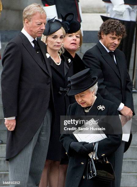 Mark Thatcher, Sarah Thatcher, Carol Thatcher and Marco Grass look on as Queen Elizabeth II leaves the ceremonial funeral service of former British...