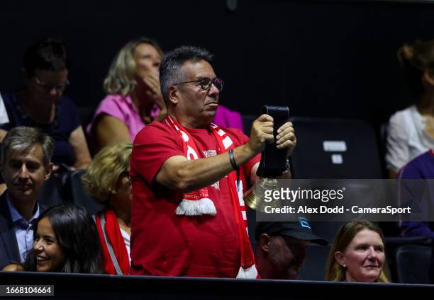 Switzerland fan rings a cow bell during the Davis Cup Final Group B singles match at the AO Arena on September 15, 2023 in Manchester, England.