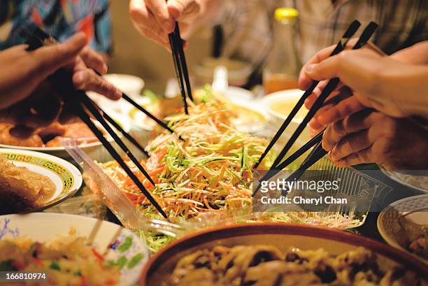 chinese traditional new year yee sang - prosperity toss stock pictures, royalty-free photos & images