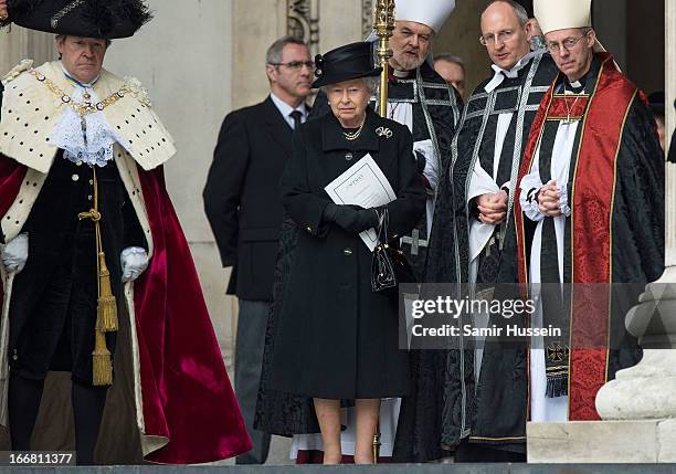 Queen Elizabeth II stands with the Bishop of London Richard Chartres and the Most Reverend Justin Welby, Archbishop of Canterbury after the...