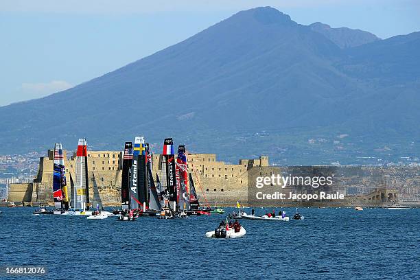 Teams sail in front of Mount Vesuvius during a practice race of America's Cup World Series Naples on April 17, 2013 in Naples, Italy.