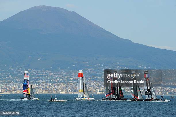 Teams sail in front of Mount Vesuvius during a practice race of America's Cup World Series Naples on April 17, 2013 in Naples, Italy.