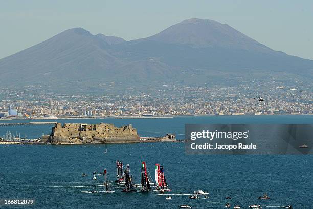 Teams sail in front of Mount Vesuvius during a practice race of America's Cup World Series Naples on April 17, 2013 in Naples, Italy.