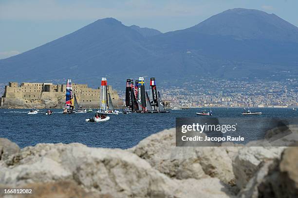 Teams sail in front of Mount Vesuvius during a practice race of America's Cup World Series Naples on April 17, 2013 in Naples, Italy.