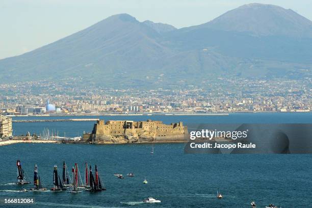 Teams sail in front of Mount Vesuvius during a practice race of America's Cup World Series Naples on April 17, 2013 in Naples, Italy.