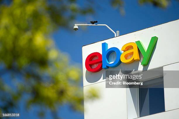 Bird sits over eBay Inc. Signage displayed on the facade of the company's headquarters in San Jose, California, U.S., on Tuesday, April 16, 2013....