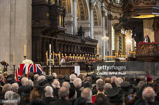 Lady Margaret Thatcher's coffin is draped in the Union flag, as the Bishop of London, Richard Chartres gives a reading during the Ceremonial funeral...
