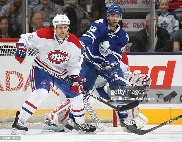 Davis Drewiske of the Montreal Canadiens keeps Nazem Kadri of the Toronto Maple Leafs in check on April 13, 2013 at the Air Canada Centre in Toronto,...