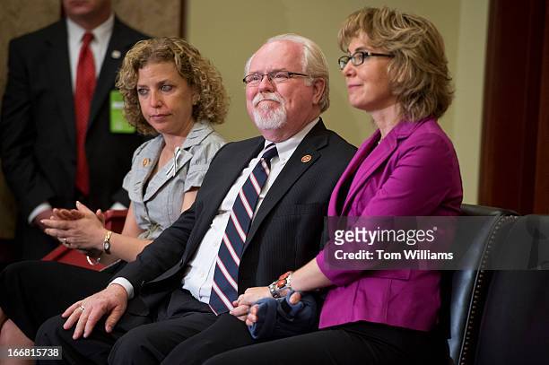 From left, Rep.Debbie Wasserman Schultz, D-Fla., Rep. Ron Barber, D-Ariz., and former Rep. Gabrielle Giffords, D-Ariz., attend an event in the...