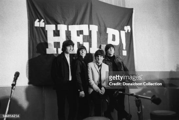 George Harrison, Ringo Starr, Paul McCartney and John Lennon of the rock and roll group "The Beatles" at a press conference for the release of their...
