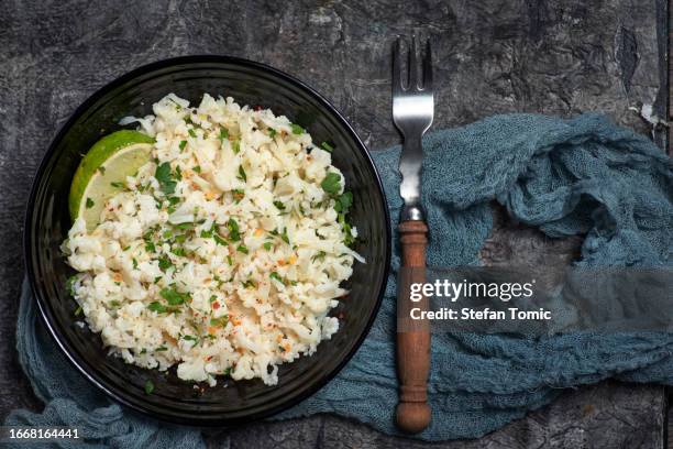 cauliflower rice with basil and lime - cauliflower rice stock pictures, royalty-free photos & images