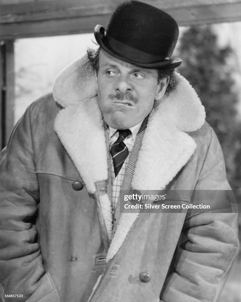 English Comic Actor Terry Thomas In A Bowler Hat And Sheepskin Coat english-comic-actor-terry-thomas-in-a-bowler-hat-and-sheepskin-coat