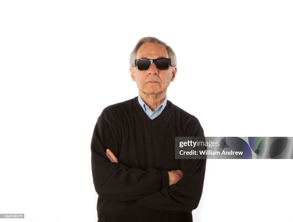 Senior man with arms crossed