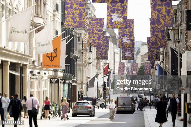 Flags for Burberry Group Plc hang on Bond Street in London, UK, on Friday, Sept. 15, 2023. The UK tourism market is lagging behind mainland Europe...