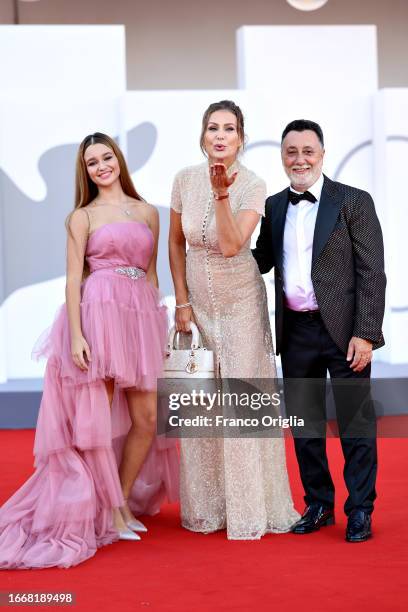 Jennifer Caroletti, Eva Henger and Massimiliano Caroletti attend a red carpet for the movie "Hors-Saison " at the 80th Venice International Film...