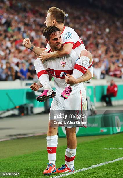 Martin Harnik of Stuttgart celebrates his team's second goal with team mate Alexandru Maxim during the DFB Cup Semi Final match between VfB Stuttgart...