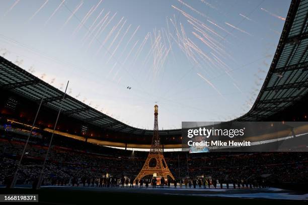 General view of the inside of the stadium, as a replica of the Eiffel Tower is seen, as the Opening Ceremony takes place prior to the Rugby World Cup...