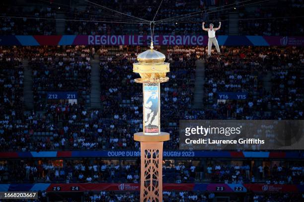 General view of the inside of the stadium, as French actor Jean Dujardin performs above a replica of the Eiffel Tower, as the Opening Ceremony takes...