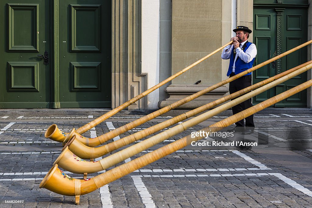 Alphorn player performing outside Jesuit Church