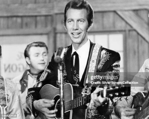 American country music singer Porter Wagoner performing, circa 1960.