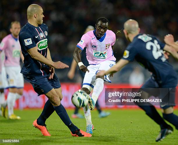 Evian's French midfielder Mohamed Rabiu strikes in front of Paris' Brazilian defender Alex during the French Cup quarter final football match Evian...