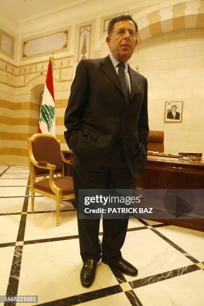 Lebanese Prime Minister Fuad Siniora stands in his office in the Serail surrounded by anti-government protesters in Beirut city center 10 December...