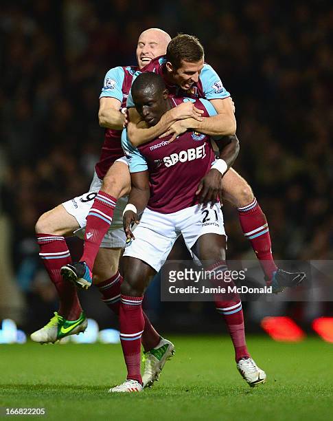Mohamed Diame of West Ham United celebrates scoring his team's second goal with team mates James Collins and Gary O'Neil during the Barclays Premier...