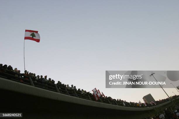 Lebanese opposition supporters gather on a bridge overlooking Beirut city center 10 December 2006 during the tenth day of an open-ended protest to...