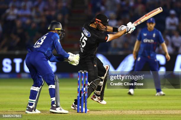 Daryl Mitchell of New Zealand hits out during the 1st Metro Bank One Day International between England and New Zealand at Sophia Gardens on September...