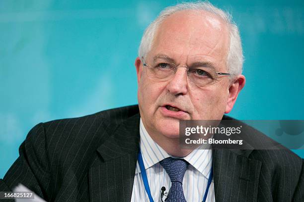 Martin Wolf, associate editor and chief economics commentator at the Financial Times, speaks at a macro policy discussion during the International...