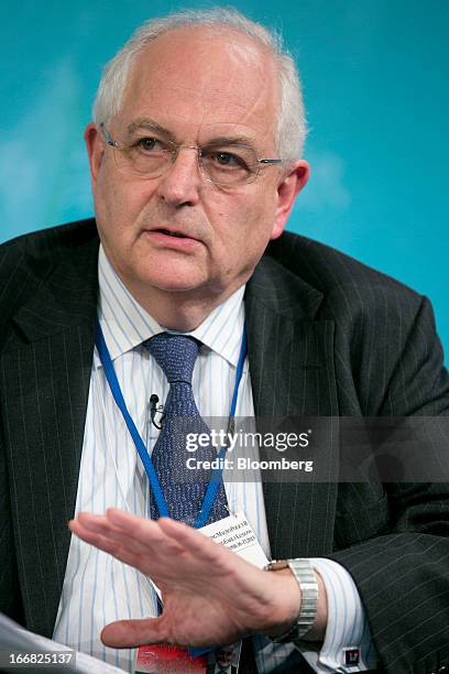 Martin Wolf, associate editor and chief economics commentator at the Financial Times, speaks at a macro policy discussion during the International...
