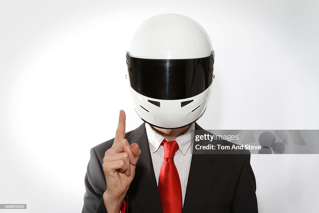 Businessman in racing driver helmet
