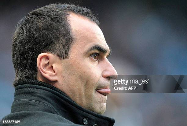 Wigan Athletic's Spanish manager Roberto Martinez looks on during the English Premier League football match between Manchester City and Wigan...