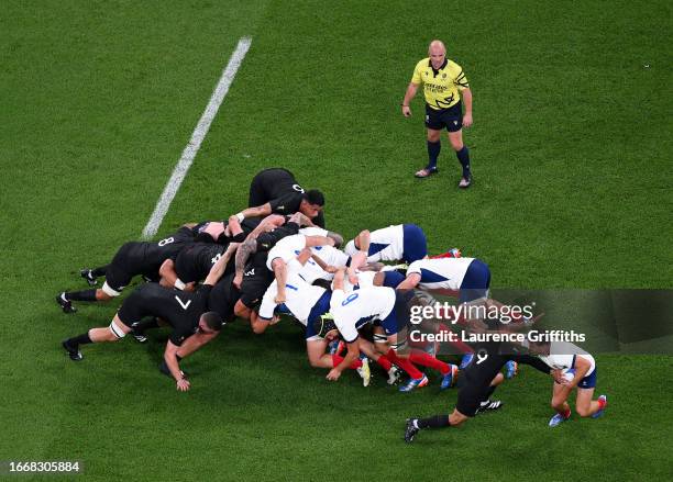 Antoine Dupont of France is tackled by Aaron Smith of New Zealand directly from the scrum during the Rugby World Cup France 2023 Pool A match between...