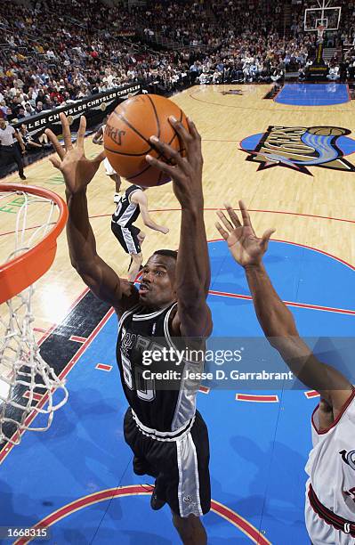 David Robinson of the San Antonio Spurs goes to the basket against the Philadelphia 76ers during the NBA game at First Union Center on November 14,...