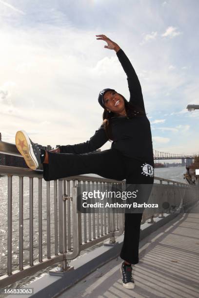 American television host Star Jones stretches before a jog, New York, New York, 2012.